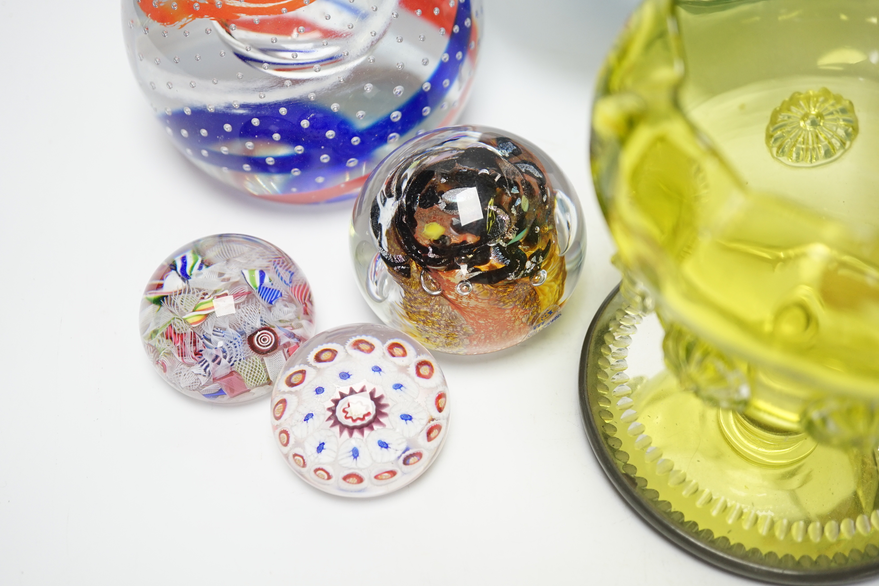 A group of mixed studio glass and a collection of four paperweights including one large Caithness